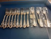 12 Smörgåsgafflar och 12 Smörgåsknivar i nysilver nysilv