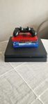 Playstation 4 slim edition med en kontroll och flera spel 