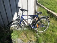 blå herrcykel cykel