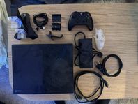 Xbox One, en kontroll och ett gäng spel.