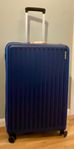 American Tourister blå resväska