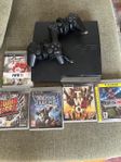 Playstation 3 med 2 kontroller samt spel