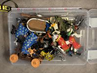 En låda full av diverse leksaker/modell-leksaker 